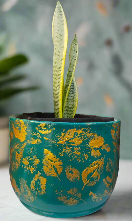 Leaf printing with gold on a turquoise green pot___ hand-painted